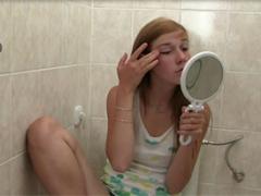 Horny Girl Sitting On The Toilet Plays With Her Wet Vagina