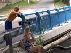 A Daring Teenage Couple Shagging Near A Bridge Outdoors