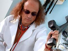 Doctor Inspecting A Perfect Teenage Patient With His Device